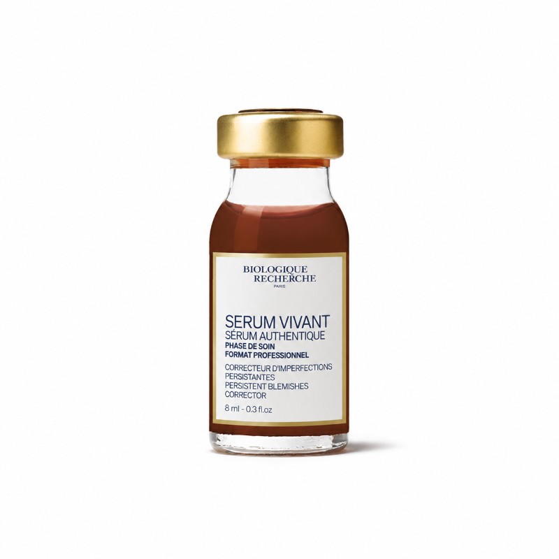 Gold-capped 0.3 oz glass bottle containing Biologique Recherche Serum Vivant, a brown/amber-colored liquid. On the bottle is a white label with a gold border, featuring text and the Biologique Recherche logo.