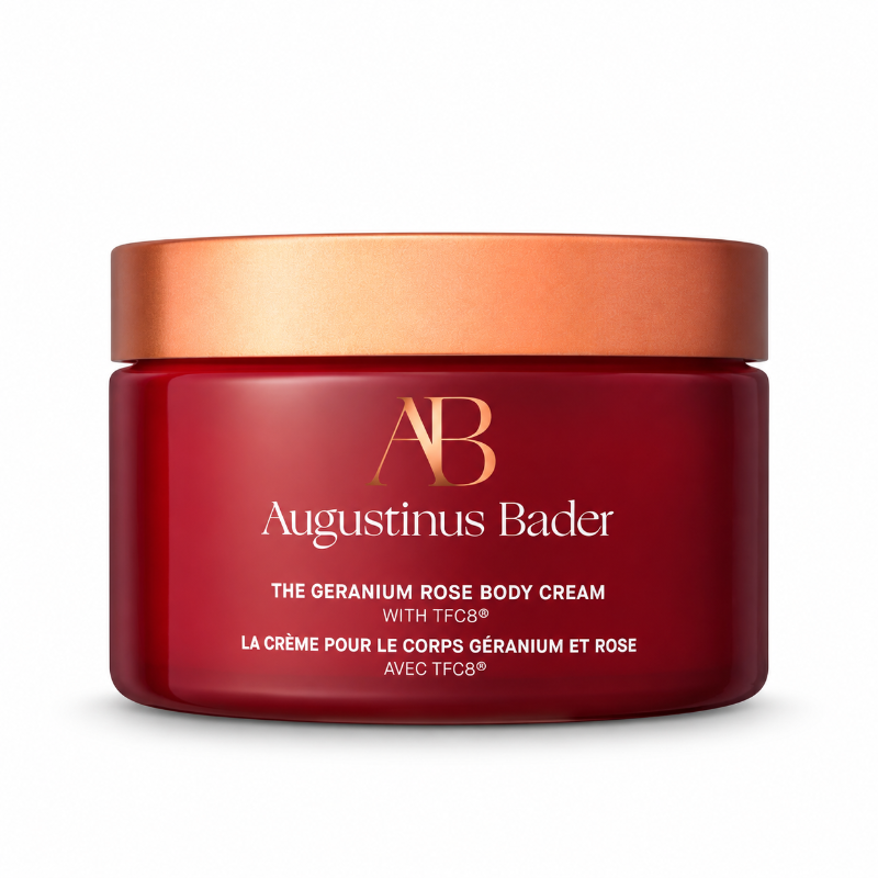 Red and Bronze Augustinus Bader cream container with white/gold text reading "The Geranium Rose Body Cream with TFC8" 
