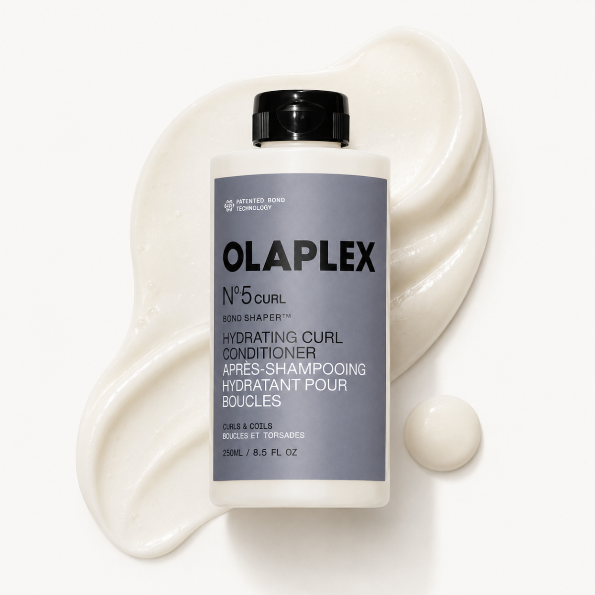 Olaplex No.5 Curl Hydrating Curl Conditioner bottle with product on a white background